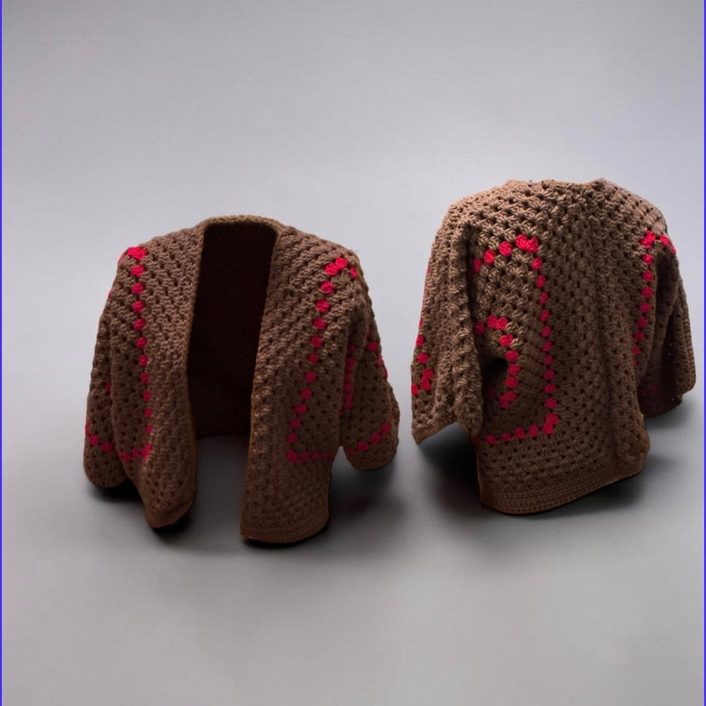 Brown crochet cardigan shown front and back, with pink floral stitching down the sleeves and back.