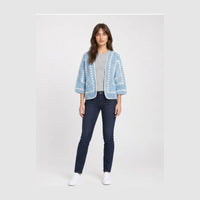 Sky blue open-front crochet cardigan with white granny-stripe trim and three-quarter balloon sleeves, worn over a grey tee.