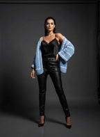 Model wearing the Sky Blue Granny-Stripe Crochet Cardigan styled with black satin and leather